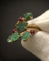 A RARE 'TUTTI FRUTTI' RING, BY CARTIER Featuring Cherry Ruby and Carved Leaf Emerald, c.1940.