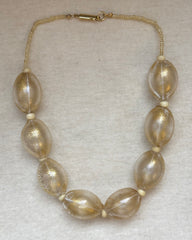 Vintage Italian large oval Murano-glass beads with a golden shimmer inside, finished with a gold-tone barrel clasp.