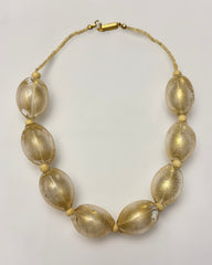 Vintage Italian large oval Murano-glass beads with a golden shimmer inside, finished with a gold-tone barrel clasp.
