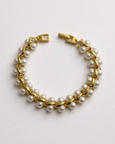 c.1970, Pearl Parade Bracelet – Gold-plated elegance with luminous faux pearls. A touch of timeless grace
