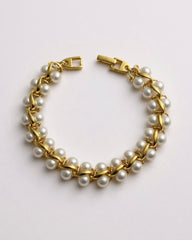 c.1970, Pearl Parade Bracelet – Gold-plated elegance with luminous faux pearls. A touch of timeless grace