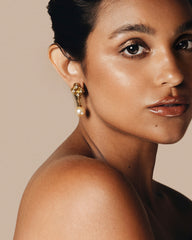 Elegant Earrings, setting with sparkling crystal accents above a luminous pearl drop. Classic sophistication.