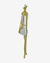 Vintage Lady Brooch – Glossy gold-tone with a white enamel hat and hand muff. A graceful nod to vintage elegance